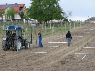 Pushing the pillars into the ground - Isn't it nice to have a tractor for the really hard stuff.